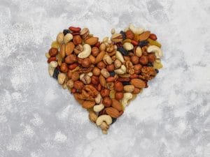 Assortment of nuts shape of heart Cashew, hazelnuts, walnuts, pi